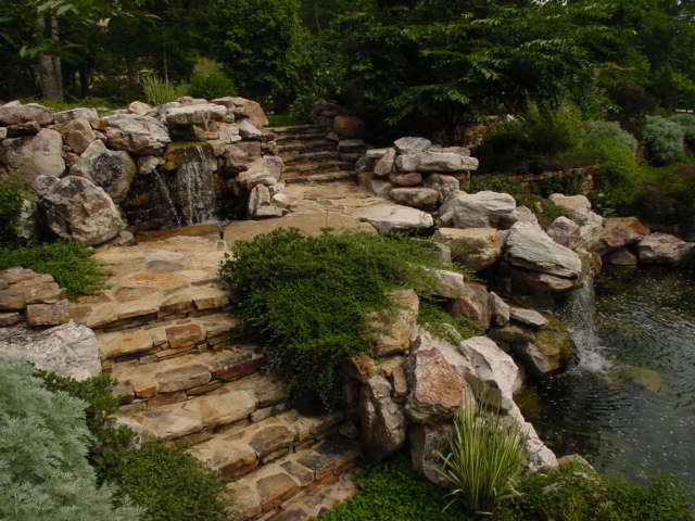 Creative Garden Spaces Inc, Chapel Hill NC, water feature, natural waterfall, water garden, koi pond, stone steps, custom stonework, natural stone stairway, landscape boulders